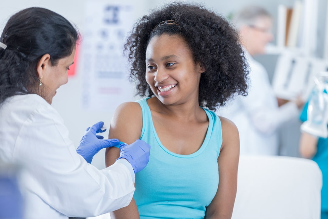 Pediatric patient receiving a vaccine